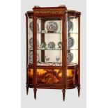 An English mahogany, ormolu and vernis martin break serpentine front vitrine, late 19th century, the
