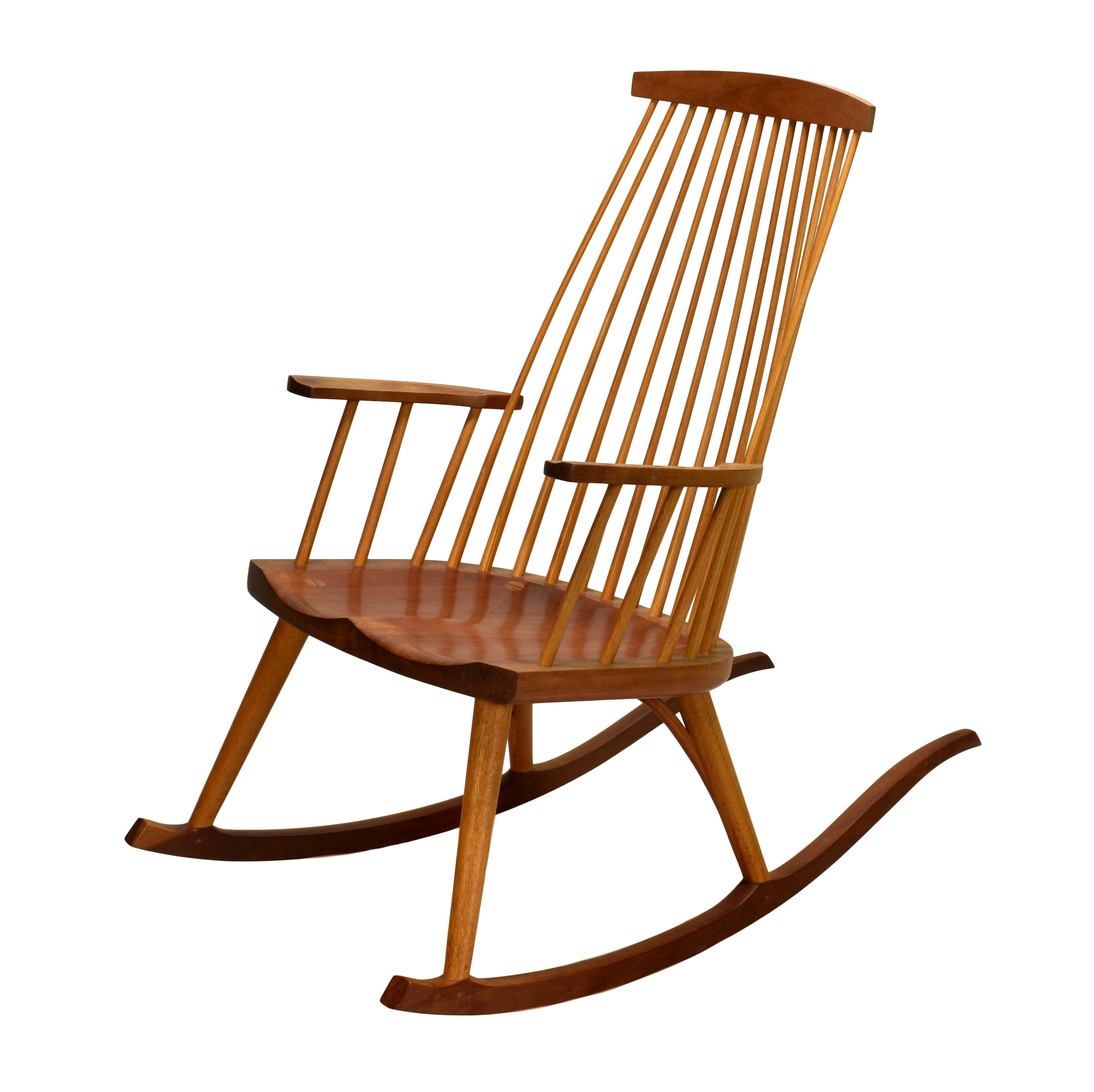 A modernist style beech and ash rocking chair, the tapered comb back over a shaped seat and arms