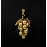 A 20ct gold pendant in the shape of a bunch of grapes, weighing approximately 15g and 44mm in