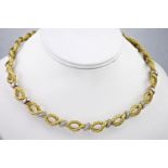 An 18ct yellow gold rope necklace set with diamonds, made of thin woven strands of yellow gold and