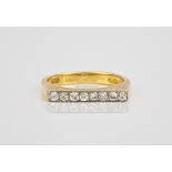 An 18ct yellow gold and diamond ring, hallmarked London 1977, the flat topped, burnished shank set