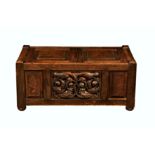 A small carved oak blanket or boot chest, 1920s-30s, the two part, hinged and panelled top over