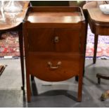 A George III mahogany tray top night table, with pierced handles to the top, over a pair of cupboard