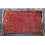 An antique Tekke Bokhara rug, probably early 20th century, the madder field with two rows of ten