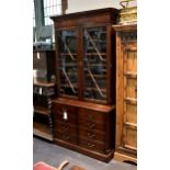 A good quality George III style mahogany library bookcase, late 20th century, the flared cavetto