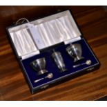 An Elizabeth II cased silver condiment set, A Chick & Sons Ltd., London 1978, comprising a covered