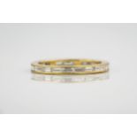 An 18ct yellow gold full eternity band, featuring baguette cut diamonds in a channel setting