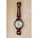 A large late Regency mahogany wheel barometer by F. Amadio & Son of London, the case with