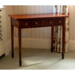 A George IV mahogany dressing or side table, the well figured cross banded mahogany top over three