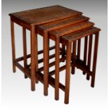 A set of Chinese hardwood quartetto tables, 1920s-30s, the rectangular tops with carved foliate