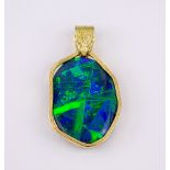 A fine 18ct gold and black opal pendant, the oval 29 x 21mm. opal of fine colour and iridescence,