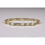 A 14ct yellow gold, cabochon opal and diamond bracelet, with four round cut diamonds to the sides of