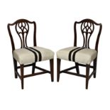 A pair of George III mahogany side chairs, the serpentine back with pierced vase splat, over a stuff