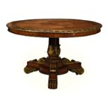 A late Regency rosewood, brass and parcel gilt centre table in the manner of George Oakley, the