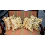 A set of four yellow silk embroidered cushions, 15¾in. (40cm.) square. (4)