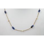A 9ct yellow gold, seed pearl and blue bead necklace, the blue beads measuring approximately 10mm in