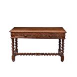 A Victorian carved honey oak two drawer centre or hall table, the cleated, three plank top with