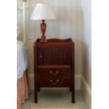 A George III mahogany tray top night table, with pierced handles to sides, over the original tambour