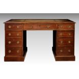 An Edwardian mahogany double pedestal desk, the moulded top with replaced sage green leather over