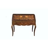A French mahogany and floral marquetry bureau, in the Louis XVI style, the fall with serpentine
