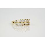 An 18ct yellow gold and diamond double row ring, featuring 14 brilliant cut diamonds with three
