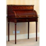 A 19th century mahogany and brass cylinder bureau, c.1860, the top with pierced brass three-