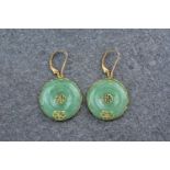A pair of 14ct yellow gold and jade Chinese drop earrings, in the shapes of pale, green discs and