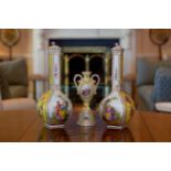 A pair of Dresden square section bottle vases, circa 1900, handpainted with figural landscape scenes