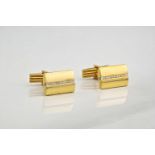 A pair of 18ct yellow gold and diamond cufflinks, Each cufflink set with 11 diamonds down a