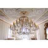 A magnificent 19th century style three tier fifty six light cut glass and gilt chandelier, second
