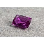 A natural, unheated loose purple sapphire, accompanied with a certificate from the Gem and Pearl