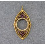 An openwork 9ct yellow gold and amethyst sovereign holder pendant, the gold frame navette in shape