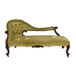 A Victorian carved rosewood chaise longue, the serpentine buttoned back with lappet and foliate
