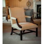 A George III style mahogany Gainsborough library chair, 19th century, the square back with