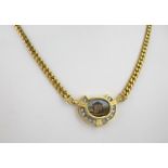 An 18ct yellow gold chain with diamond set mosaic pendant, the pendant measuring approximately