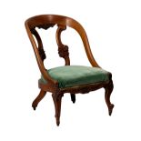 A William IV walnut chariot back chair, the open back with two carved twin scroll bars and a