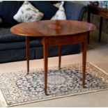 An early 19th century Hepplewhite style mahogany oval Pembroke table, the satinwood cross banded top