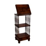 A William IV rosewood three tier whatnot with reading stand, the hinged reading stand to the top
