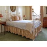 A Victorian brass and cast iron king size bedstead, 60in. (152.5cm.) wide, 82in. (208.25cm.) long,