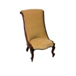 An early Victorian carved rosewood slipper back chair, the scroll top back carved with foliate and