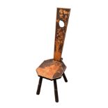 A pokerwork spinning chair, late 19th / early 20th century, the tapered pierced back decorated