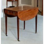 A Regency mahogany Pembroke table, the rounded, rectangular, cross banded dropflap top over a single