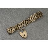 A 9ct gold gate link bracelet, with bark effect 9ct gold heart padlock clasp, hallmarked Birm. 1992.