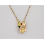 A 9ct rose and yellow gold, emerald and diamond necklace, featuring 2 round cut emeralds and one