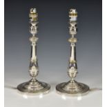 A pair of silver plated candlestick lamps, early 20th century, later converted to electricity,