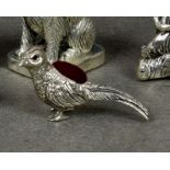 A modern novelty silver pin cushion fashioned as a pheasant, stamped sterling 925, having red