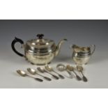 A George V silver teapot and cream jug, Sibray, Hall & Co. Ltd., London 1913, oval form with wriggle
