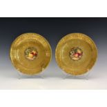 Two Royal Worcester 'Fruit' gilded porcelain cabinet plates, each with indistinct signatures,