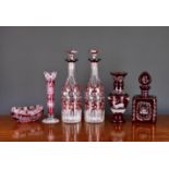 A small collection of Bohemian ruby flashed glass, to include a pair of bottle decanters,