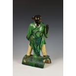 A Chinese sancai glazed pottery figural roof ridge tile depicting Zhi Bajie, Ming Dynasty (1368-